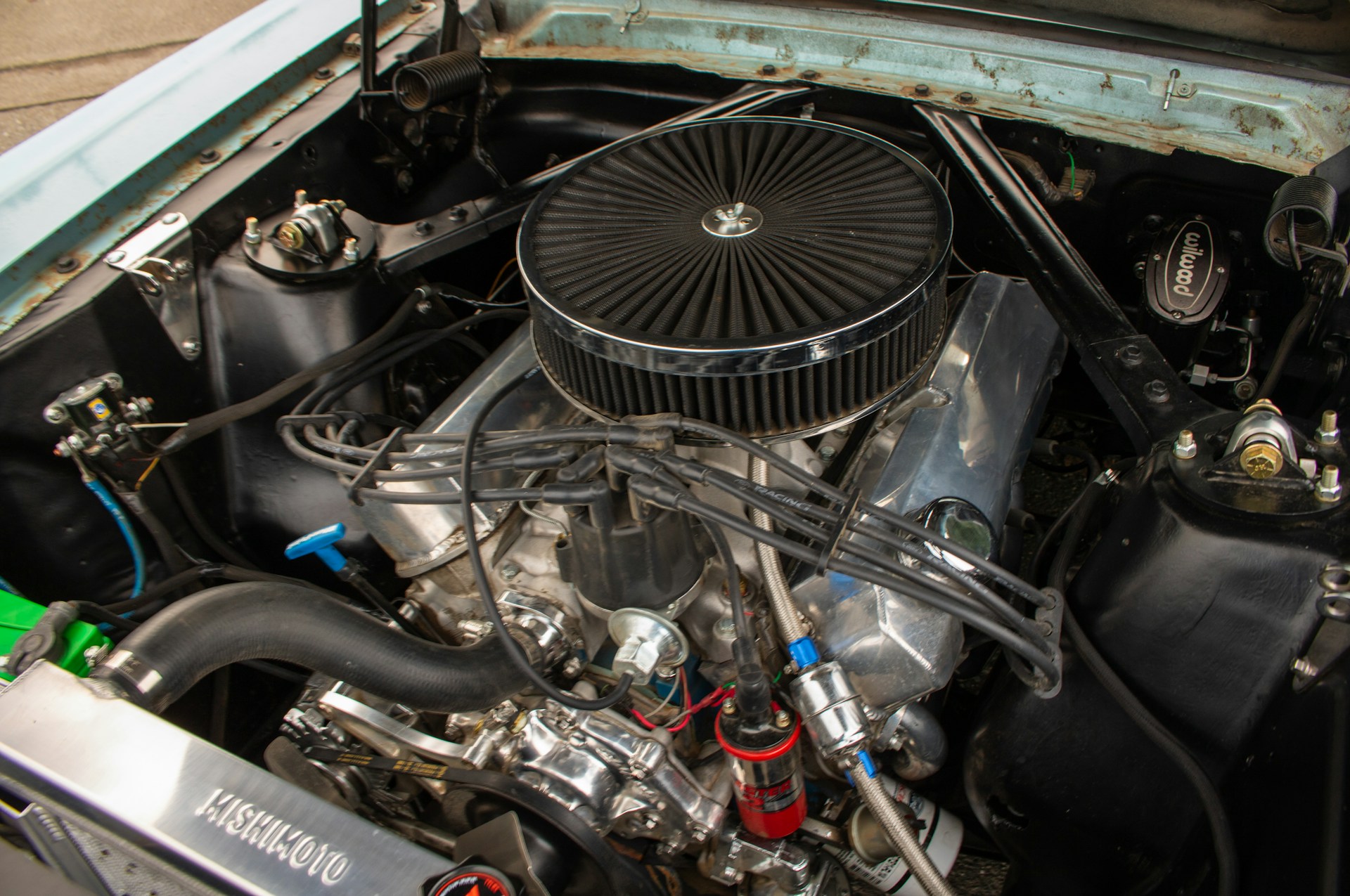 zoshua-colah-Y9cp-OjfNu4-unsplash The engine compartment of a car with the hood up